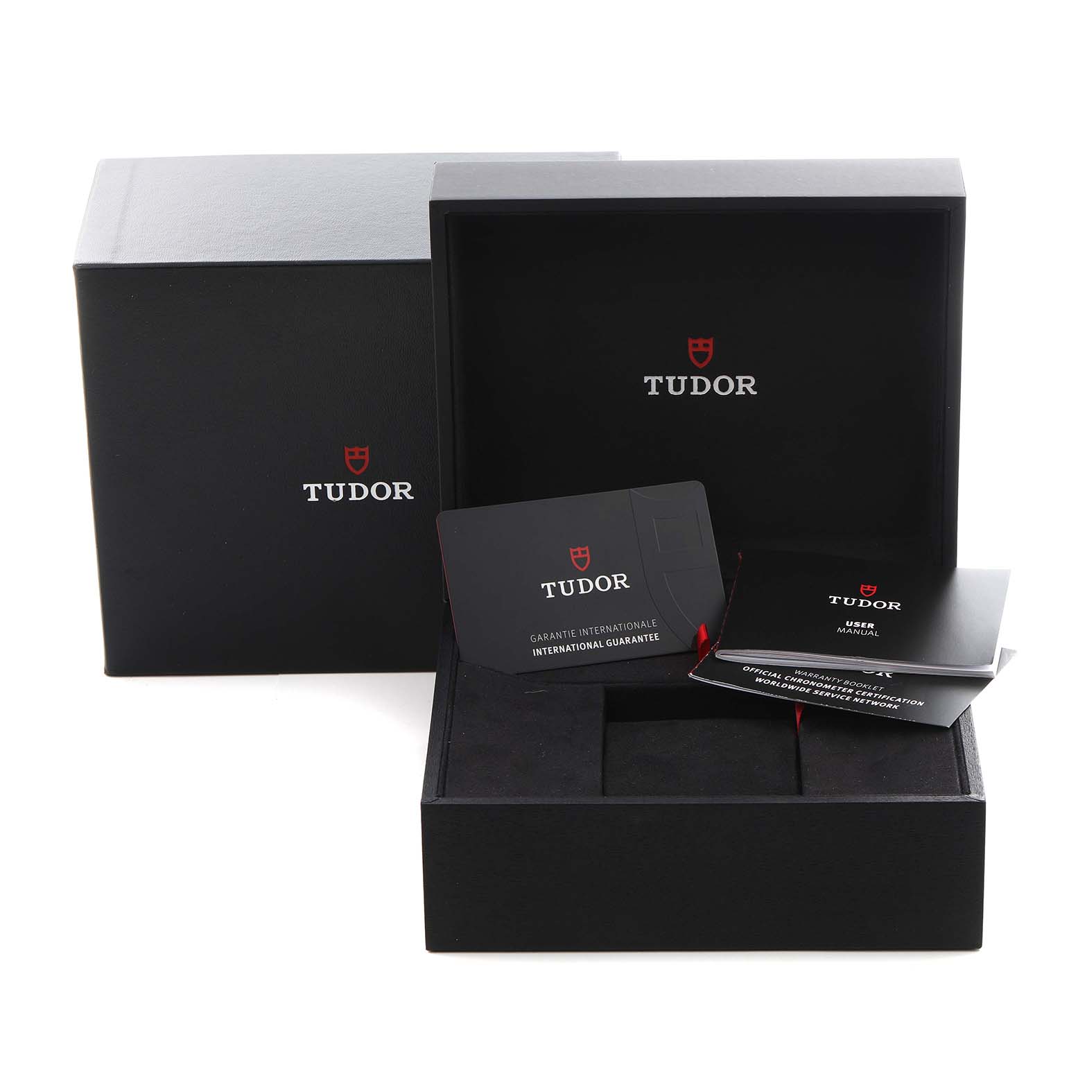 The image shows an open Tudor Heritage Black Bay 79010 Men
s Stainless Steel Grey Dial 79010 Men
s Stainless Steel Grey Dial watch box with guarantee cards and booklets.