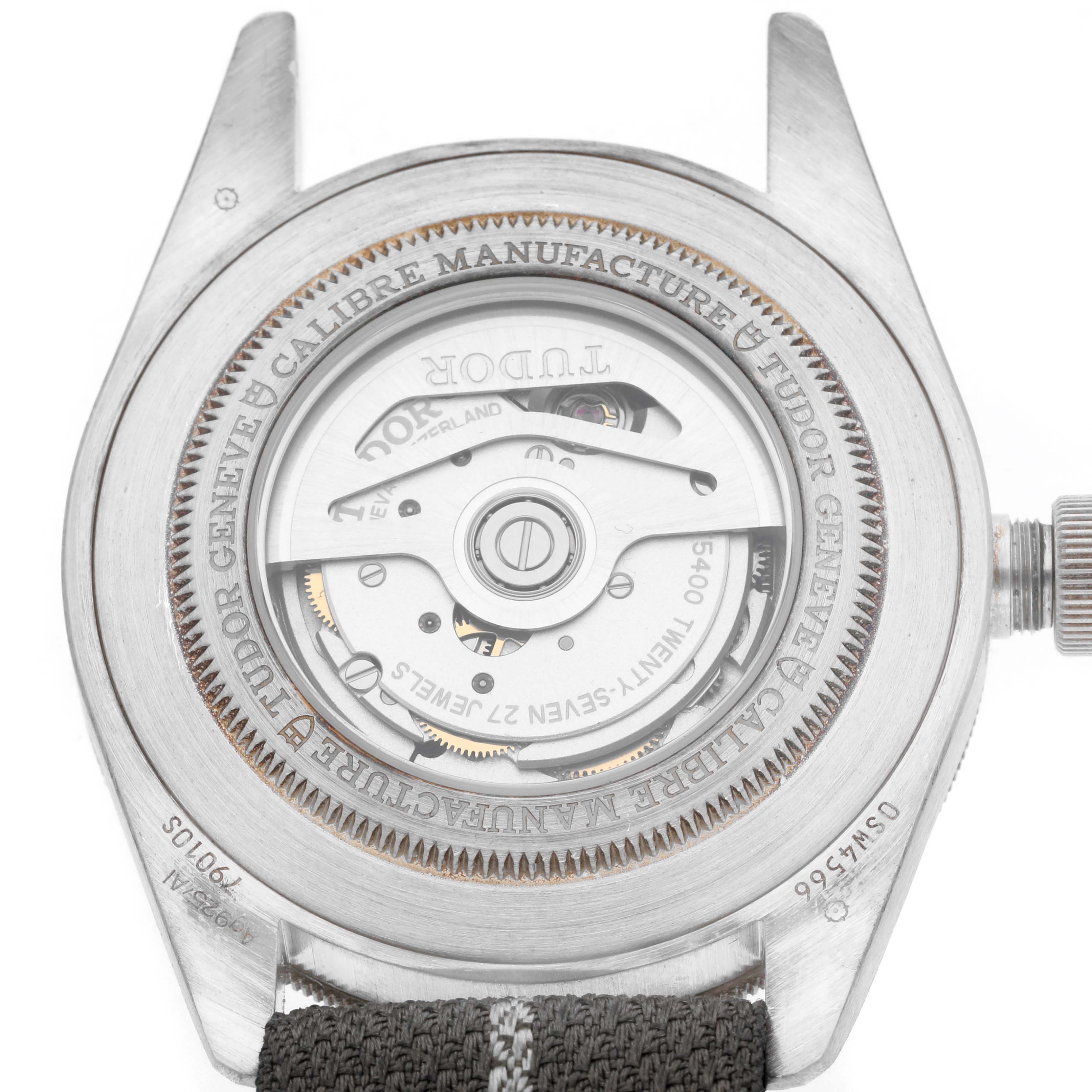 The Tudor Heritage Black Bay 79010 Men
s Stainless Steel Grey Dial 79010 Men
s Stainless Steel Grey Dial watch is shown from the back, displaying its movement and case details.