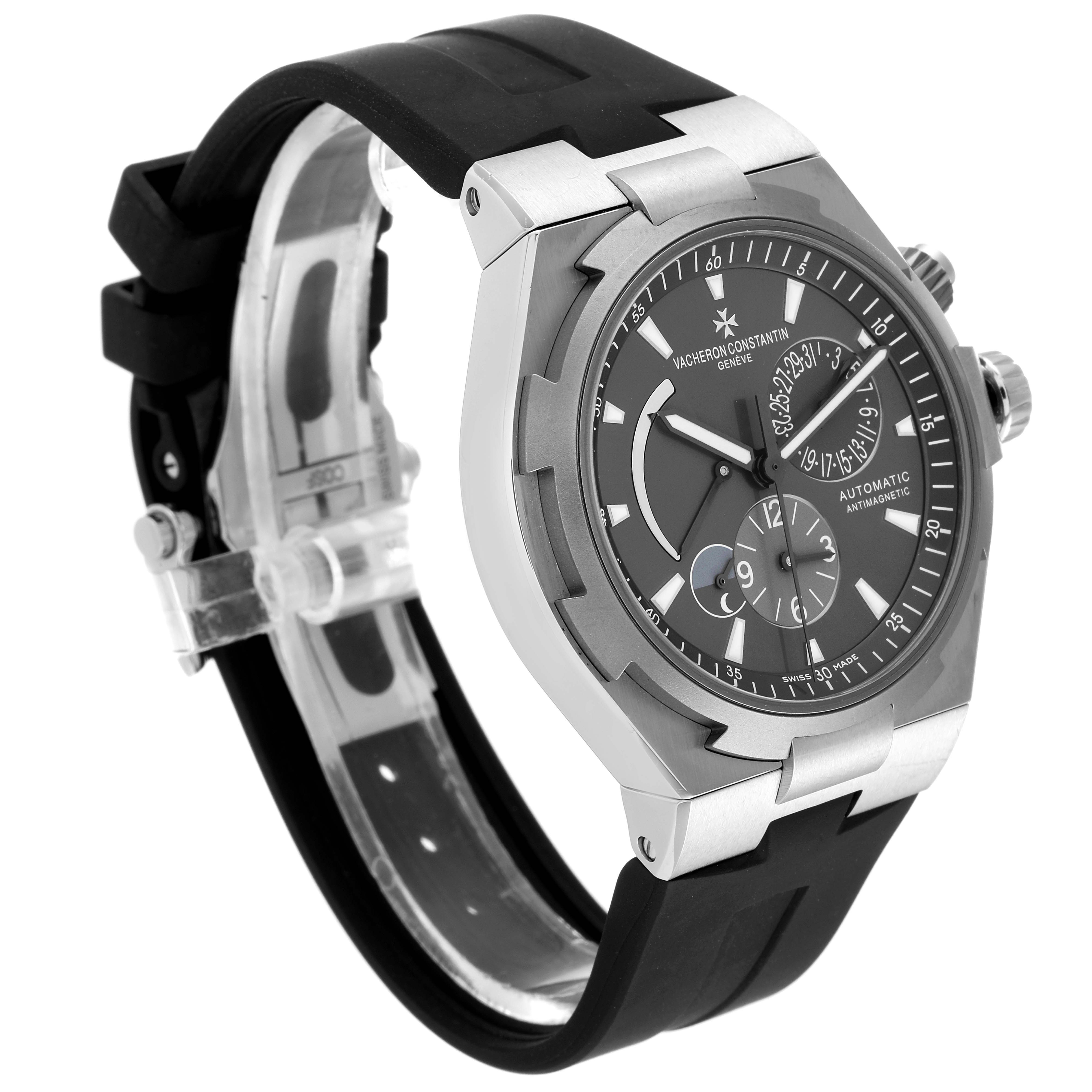 This image shows a side angle of the Vacheron Constantin Overseas 47450/000W-9511 Men's Stainless Steel Grey Dial 47450/000W-9511 Men's Stainless Steel Grey Dial watch, detailing its dial, crown, and black strap.