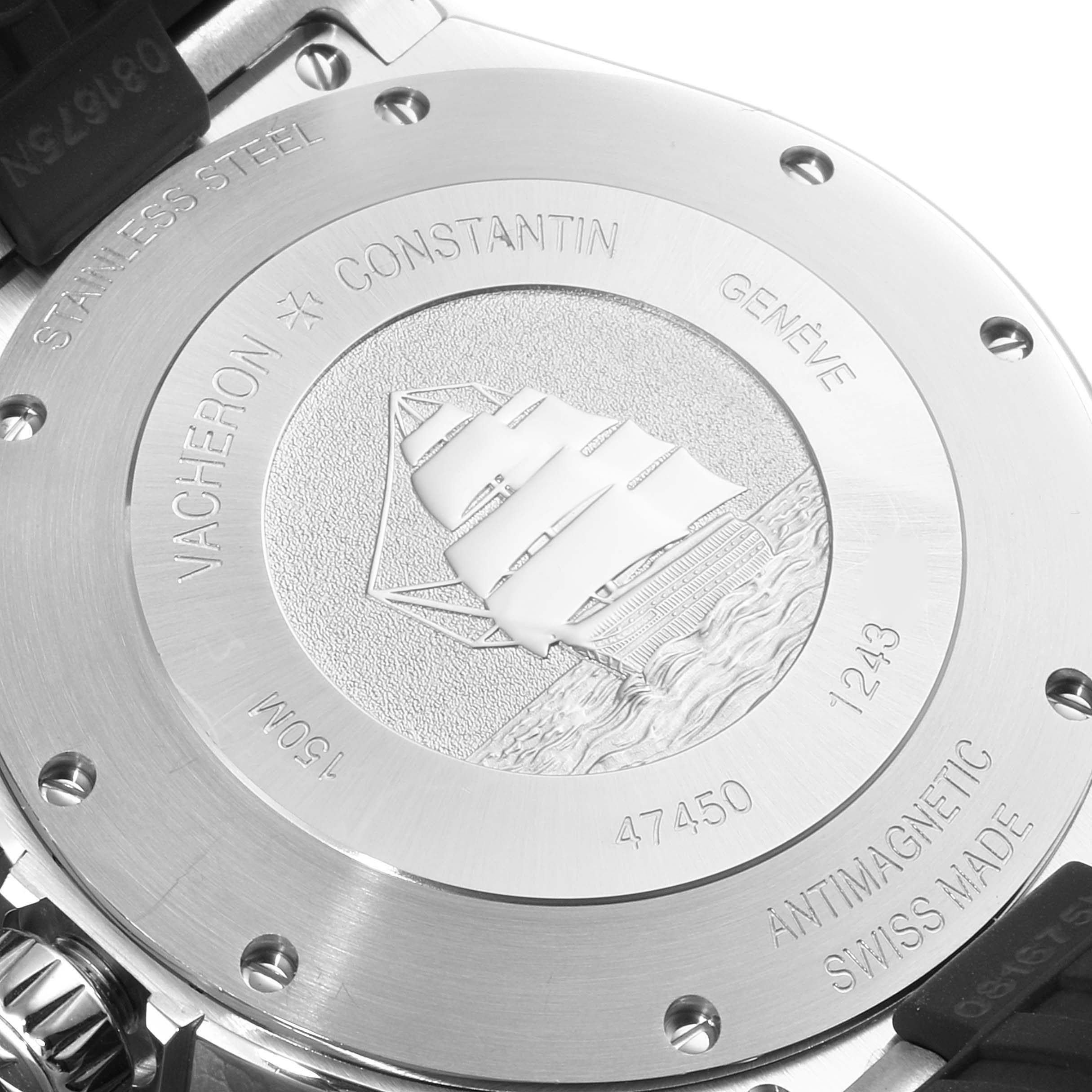 The image shows the back case of the Vacheron Constantin Overseas 47450/000W-9511 Men's Stainless Steel Grey Dial 47450/000W-9511 Men's Stainless Steel Grey Dial watch, featuring an engraved sailboat design and labeling.