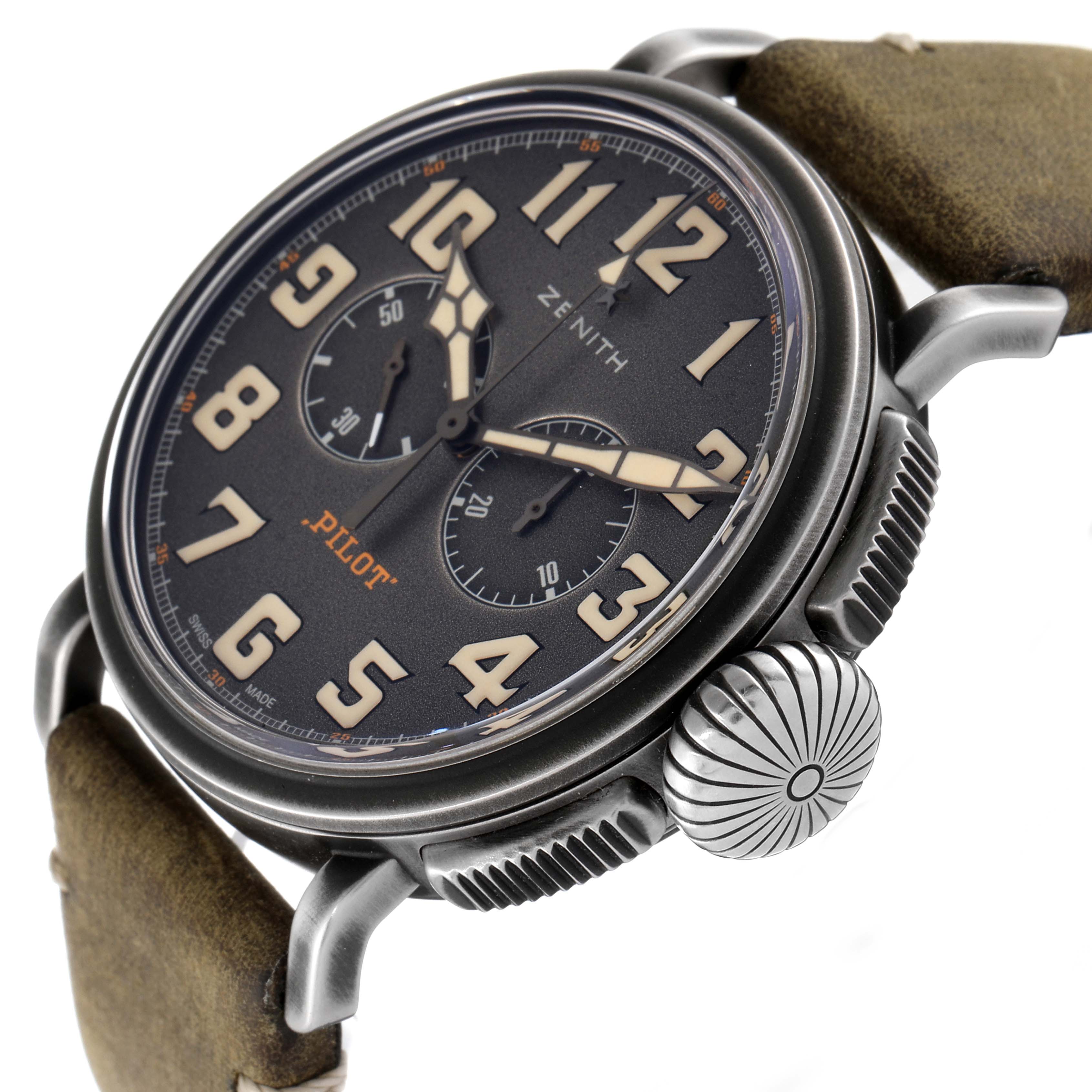 The Zenith Pilot 11.2430.4069/21.C773 Men's Stainless Steel Grey Dial 11.2430.4069/21.C773 Men's Stainless Steel Grey Dial watch is shown at an angle highlighting the dial, crown, pushers, and part of the leather strap.