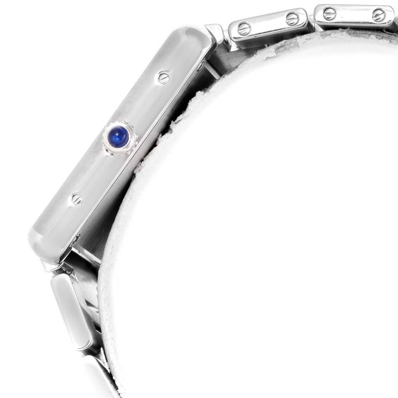 The image shows a side view of the Cartier Tank Solo W5200014 Men's Stainless Steel Silver Dial W5200014 Men's Stainless Steel Silver Dial watch, highlighting the crown with a blue gem and part of the bracelet.