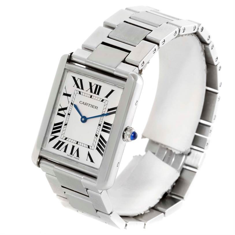 The image shows a Cartier Tank Solo W5200014 Men's Stainless Steel Silver Dial W5200014 Men's Stainless Steel Silver Dial watch angled to display its face, bracelet, and crown with a blue cabochon.