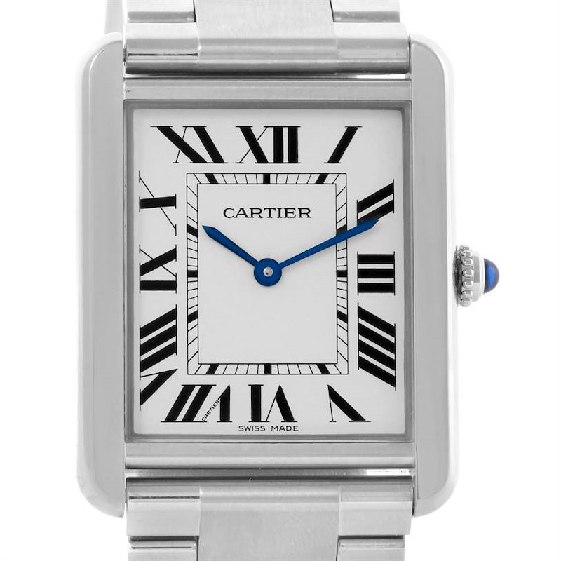 The image shows the face and bezel of the Cartier Tank Solo watch, featuring Roman numerals and blue hands, at a front angle.