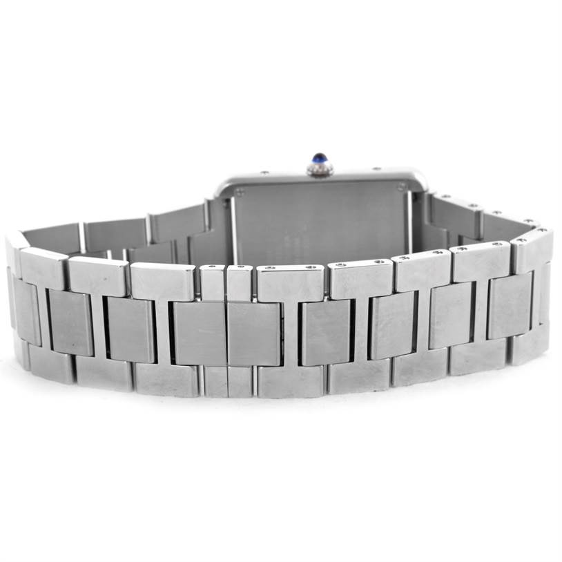 The image shows the back and bracelet of a Cartier Tank Solo W5200014 Stainless Steel Silver Dial W5200014 Stainless Steel Silver Dial watch, highlighting its linked metal band and the crown with sapphire cabochon.