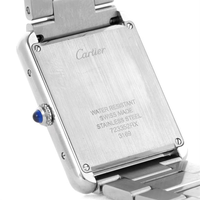 This image shows the back case of a Cartier Tank Solo W5200014 Stainless Steel Silver Dial W5200014 Stainless Steel Silver Dial watch, featuring the inscription and part of the bracelet.
