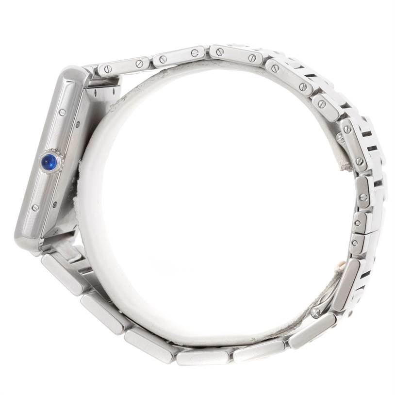 The image shows a side view of a Cartier Tank Solo W5200028 Men
s Stainless Steel Silver Dial W5200028 Men
s Stainless Steel Silver Dial watch, highlighting the case, crown, and metal bracelet.
