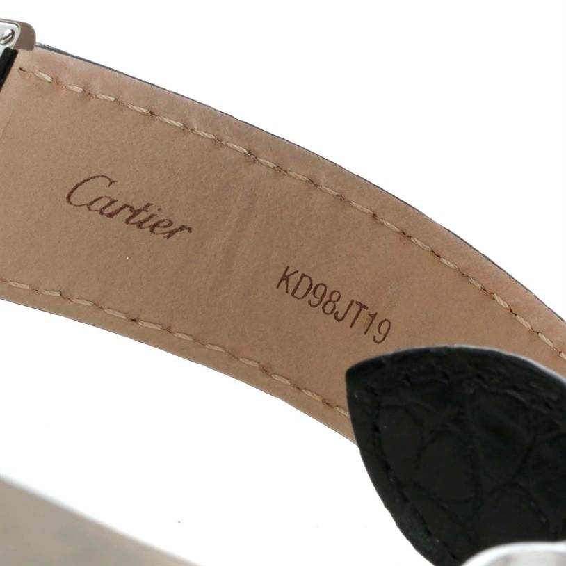 This is an interior shot of the band for a Cartier Tank Solo W1018355 Men
s Stainless Steel Silver Dial W1018355 Men
s Stainless Steel Silver Dial watch, showing the Cartier branding and model number.