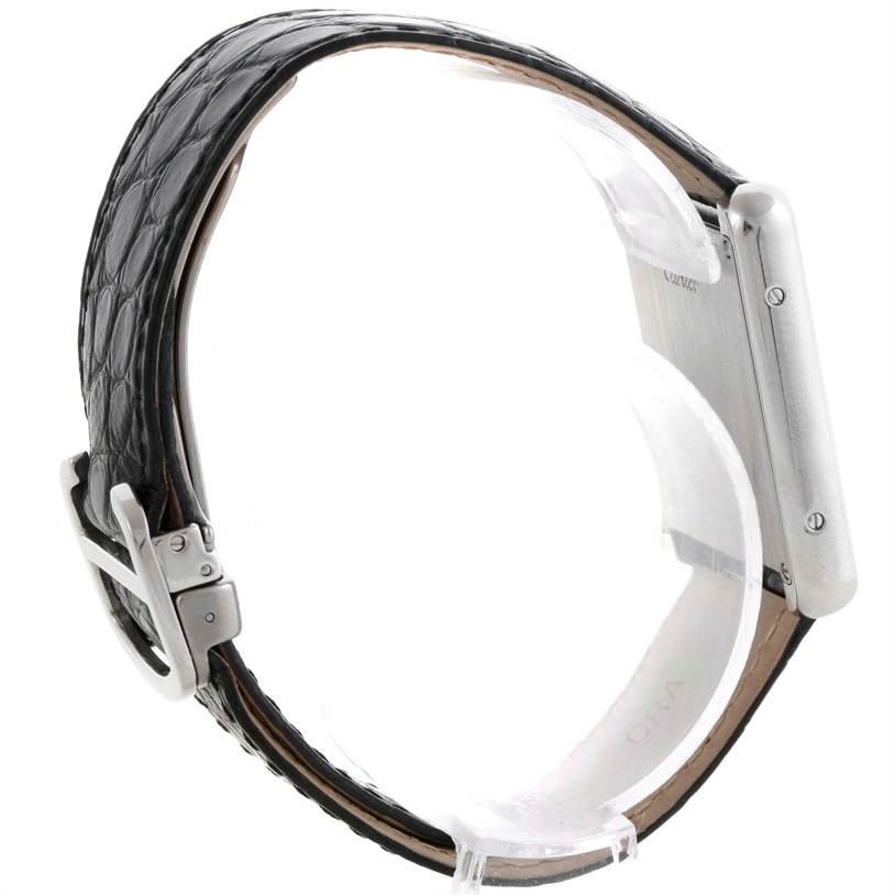 The image shows a side view of a Cartier Tank Solo W1018355 Men
s Stainless Steel Silver Dial W1018355 Men
s Stainless Steel Silver Dial watch, highlighting its buckle, strap, and case.