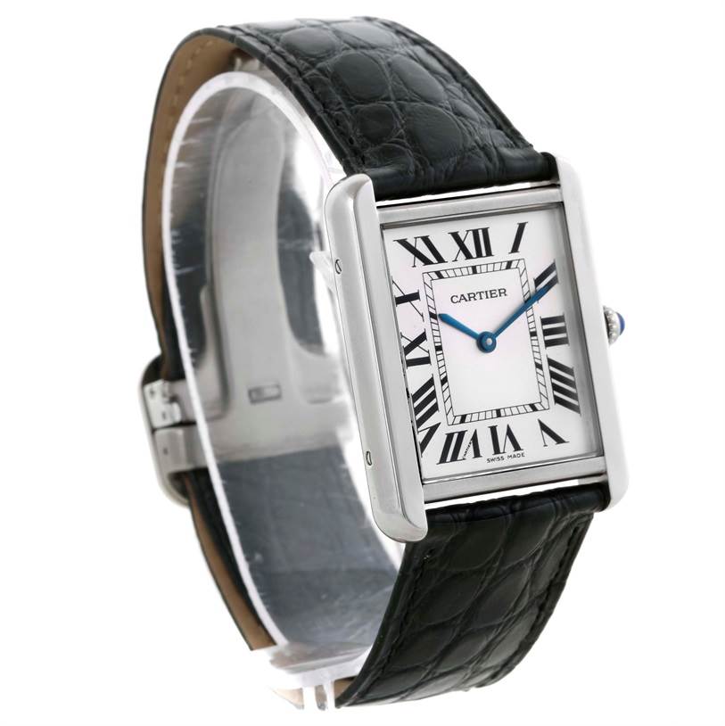 The image shows a Cartier Tank Solo W1018355 Men
s Stainless Steel Silver Dial W1018355 Men
s Stainless Steel Silver Dial watch at an angled side view highlighting the face, strap, and deployment clasp.