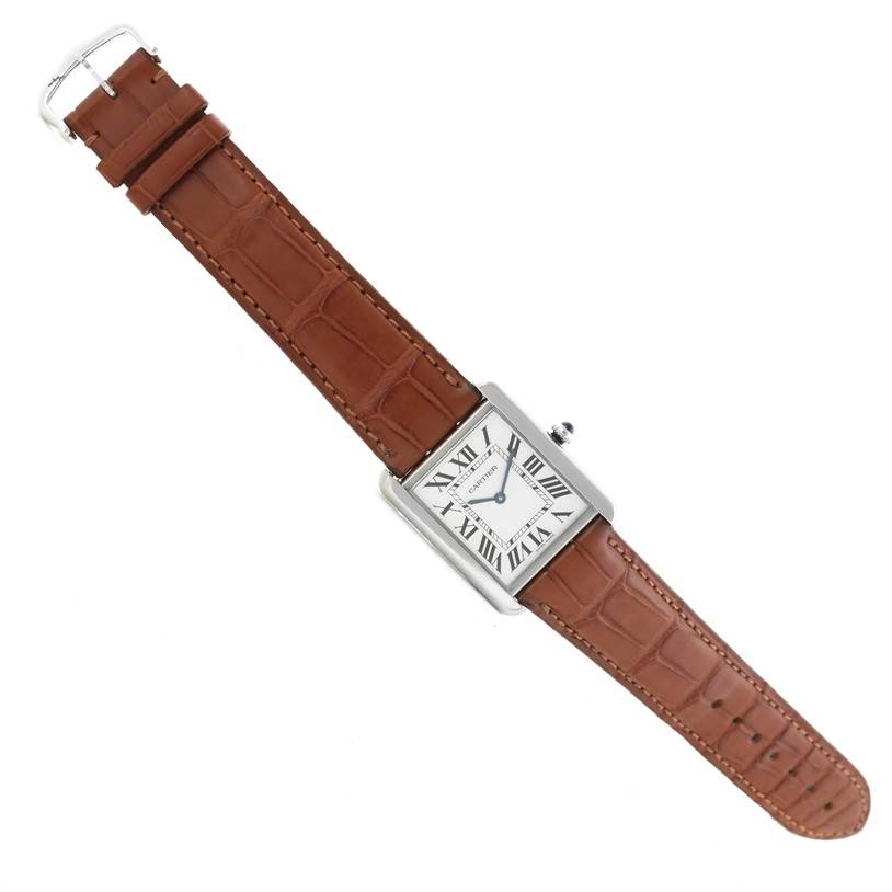 The image shows a Cartier Tank Solo W1018355 Men
s Stainless Steel Silver Dial W1018355 Men
s Stainless Steel Silver Dial watch with a rectangular face and brown leather strap, from an overhead angle.