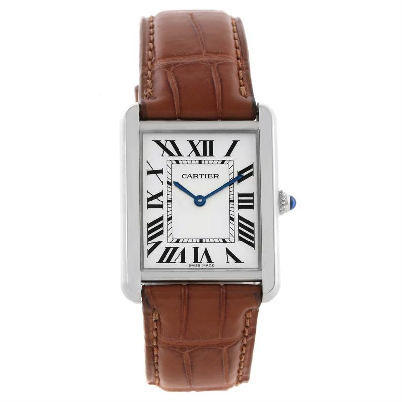 The image shows a Cartier Tank Solo W1018355 Men
s Stainless Steel Silver Dial W1018355 Men
s Stainless Steel Silver Dial watch from a front angle, displaying its face, brown leather strap, and blue hands.