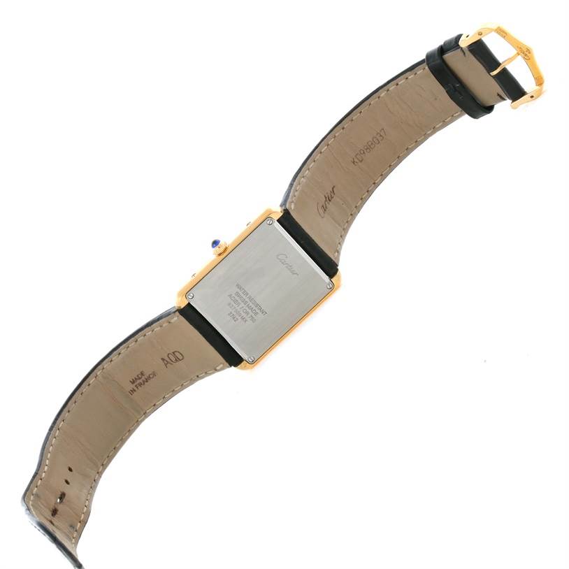 This image shows the back view of the Cartier Tank Solo W1018855 Men
s Steel and Gold (two tone) Silver Dial W1018855 Men
s Steel and Gold (two tone) Silver Dial watch, displaying its case back and leather strap.