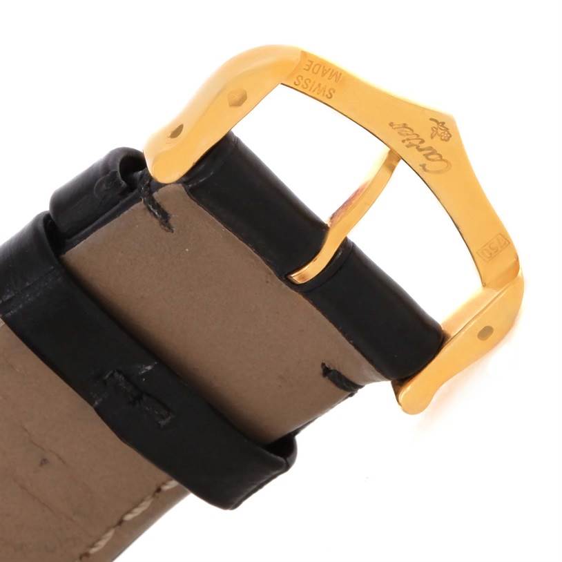 This image shows a close-up view of the leather strap and gold buckle of a Cartier Tank Solo W1018855 Men
s Steel and Gold (two tone) Silver Dial W1018855 Men
s Steel and Gold (two tone) Silver Dial watch.