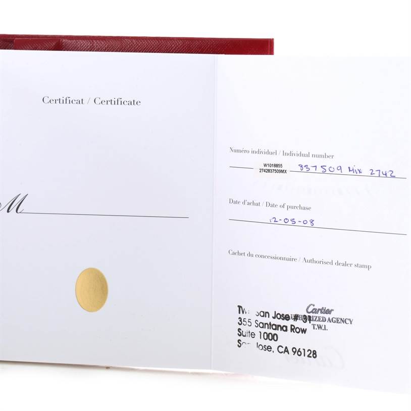 The image shows the certificate for the Cartier Tank Solo W1018855 Men
s Steel and Gold (two tone) Silver Dial W1018855 Men
s Steel and Gold (two tone) Silver Dial watch, including the date of purchase and dealer stamp.