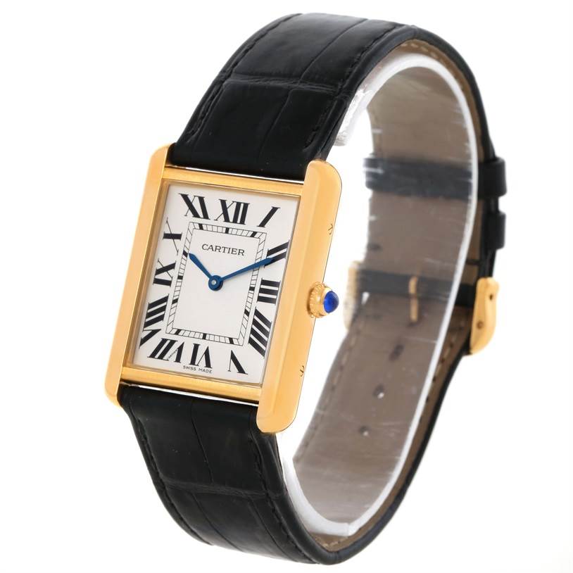 The image shows a Cartier Tank Solo W1018855 Men
s Steel and Gold (two tone) Silver Dial W1018855 Men
s Steel and Gold (two tone) Silver Dial watch at a slight angle, featuring the face, bezel, crown with a blue gem, and part of the black leather strap.