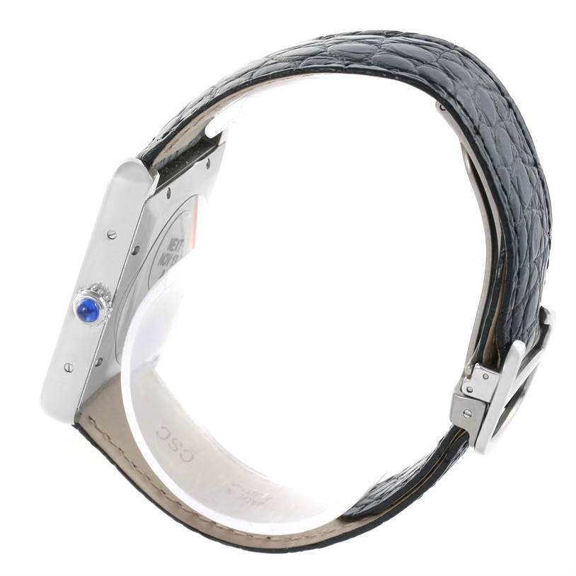 The image shows a side angle of a Cartier Tank Solo W5200027 Men
s Stainless Steel Silver Dial W5200027 Men
s Stainless Steel Silver Dial watch, displaying its crown, case, and black leather strap.