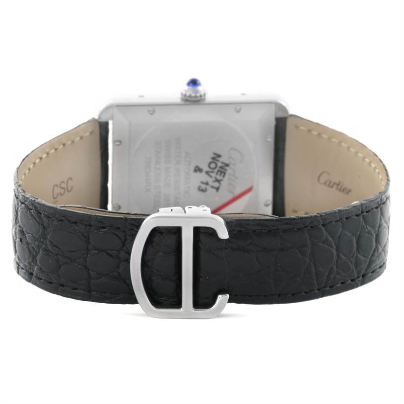 The image shows the back of the Cartier Tank Solo W5200027 Men
s Stainless Steel Silver Dial W5200027 Men
s Stainless Steel Silver Dial watch, highlighting the black leather strap and the initial "C" buckle.