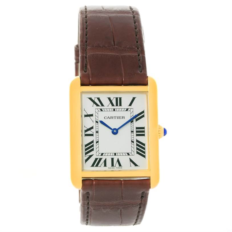The Cartier Tank Solo W1018855 Men
s Steel and Gold (two tone) Silver Dial W1018855 Men
s Steel and Gold (two tone) Silver Dial watch is shown from a front angle, displaying the face, gold case, crown, and brown leather strap.
