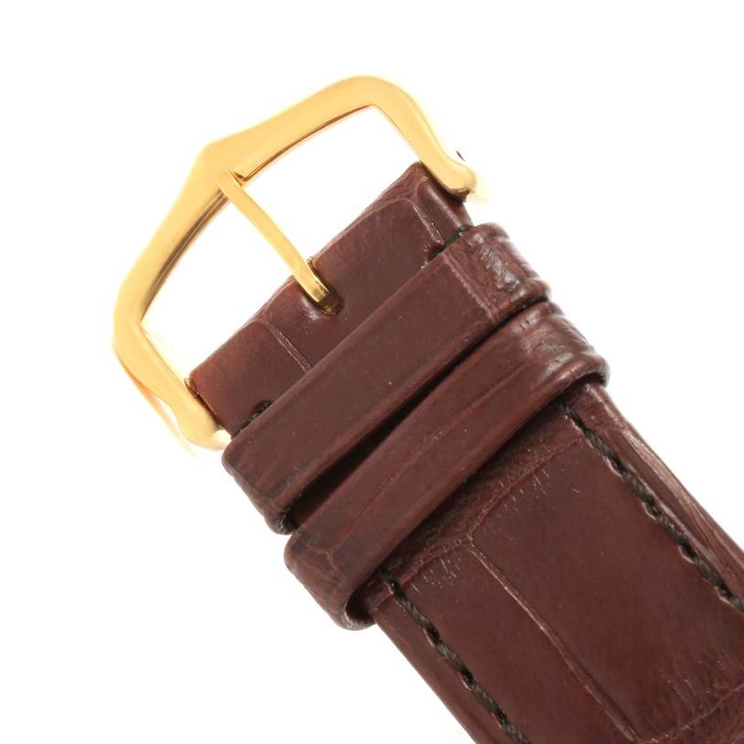 This image shows a brown leather strap with a gold buckle from the Cartier Tank Solo W1018855 Men
s Steel and Gold (two tone) Silver Dial W1018855 Men
s Steel and Gold (two tone) Silver Dial model watch.