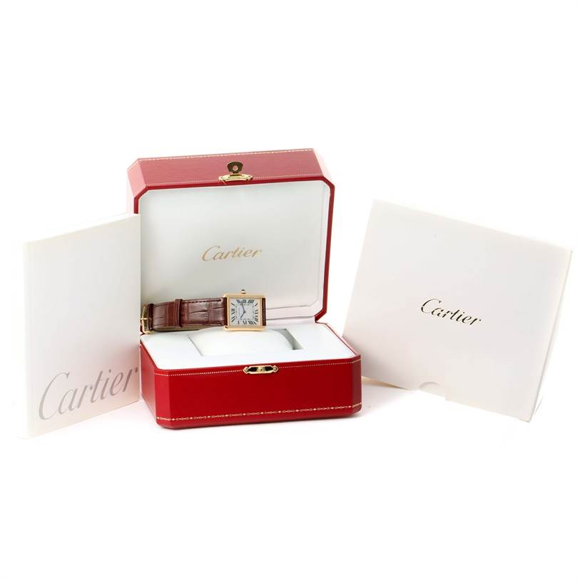 The Cartier Tank Solo W1018855 Men
s Steel and Gold (two tone) Silver Dial W1018855 Men
s Steel and Gold (two tone) Silver Dial watch is displayed front-angled in its red box, flanked by white Cartier booklets.
