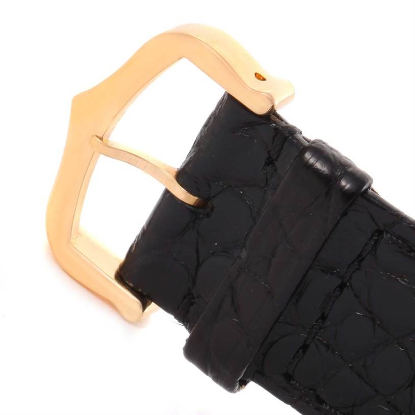 The image shows the gold buckle and black leather strap of a Cartier Tank Solo W5200025 Steel and Gold (two tone) Silver Dial W5200025 Steel and Gold (two tone) Silver Dial watch, viewed from the top.