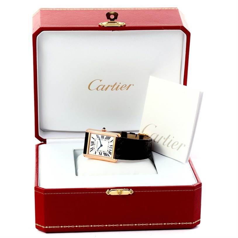 The image shows a Cartier Tank Solo W5200025 Steel and Gold (two tone) Silver Dial W5200025 Steel and Gold (two tone) Silver Dial watch and booklet, placed in an open red Cartier case.