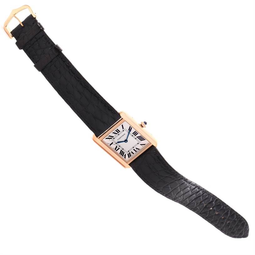 This Cartier Tank Solo W5200025 Steel and Gold (two tone) Silver Dial W5200025 Steel and Gold (two tone) Silver Dial watch is shown at a slight angle, displaying its rectangular face, black leather strap, and gold buckle.