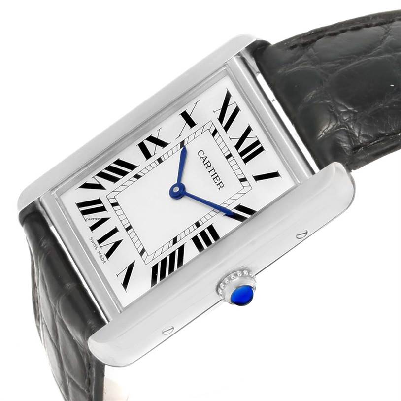 The image shows a Cartier Tank Solo W1018355 Stainless Steel Silver Dial W1018355 Stainless Steel Silver Dial watch at an oblique angle, highlighting its face, blue hands, crown, and leather strap.