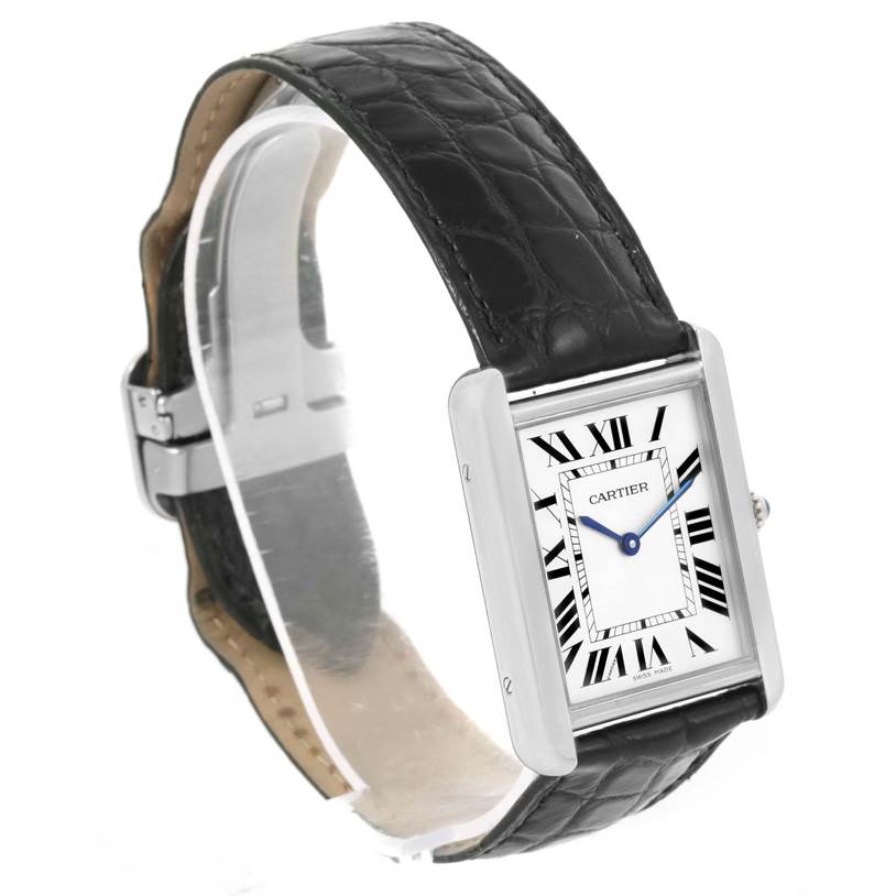The image shows a Cartier Tank Solo W1018355 Stainless Steel Silver Dial W1018355 Stainless Steel Silver Dial watch at a three-quarter angle, highlighting its rectangular face, black leather strap, and blue hands.