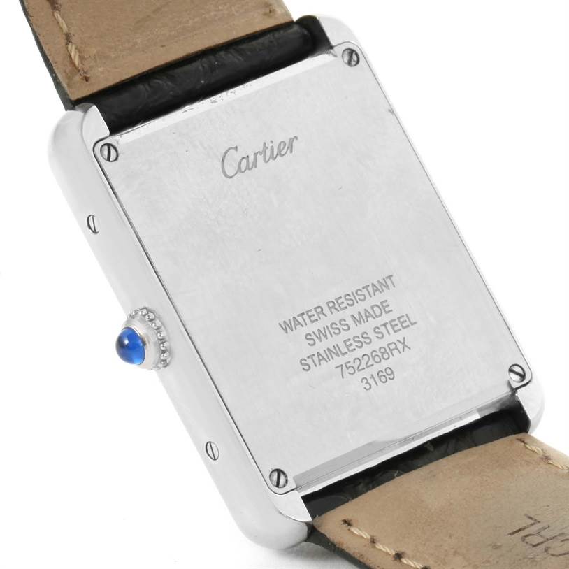 The image shows the back case of a Cartier Tank Solo W1018355 Stainless Steel Silver Dial W1018355 Stainless Steel Silver Dial watch, displaying the brand
s engraving and model details.