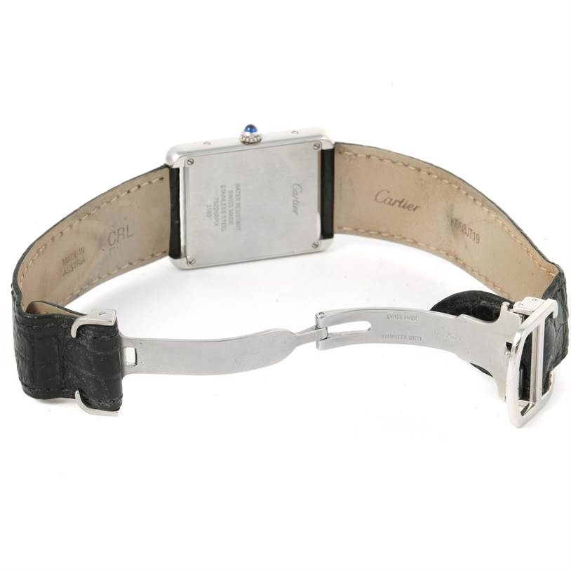 The image shows the back of a Cartier Tank Solo W1018355 Stainless Steel Silver Dial W1018355 Stainless Steel Silver Dial watch, highlighting the leather strap and metal clasp.