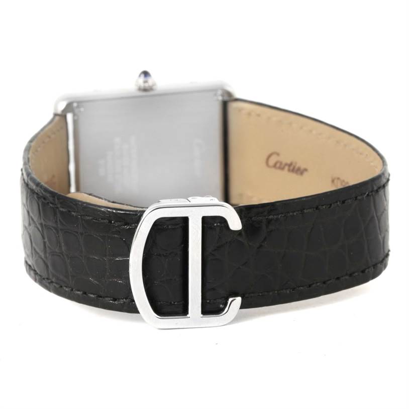 The image shows the back of the Cartier Tank Solo W1018355 Men
s Stainless Steel Silver Dial W1018355 Men
s Stainless Steel Silver Dial watch, highlighting the clasp and leather strap.