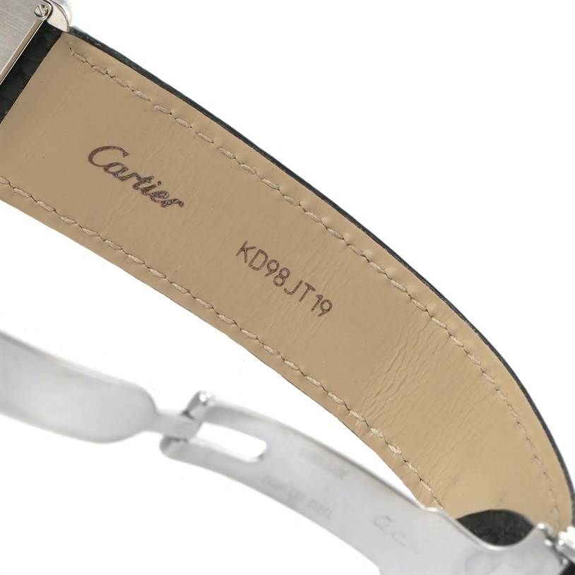 The image shows the inside view of a Cartier Tank Solo W1018355 Men
s Stainless Steel Silver Dial W1018355 Men
s Stainless Steel Silver Dial watch strap, focusing on the stitched leather and part of the metal clasp.