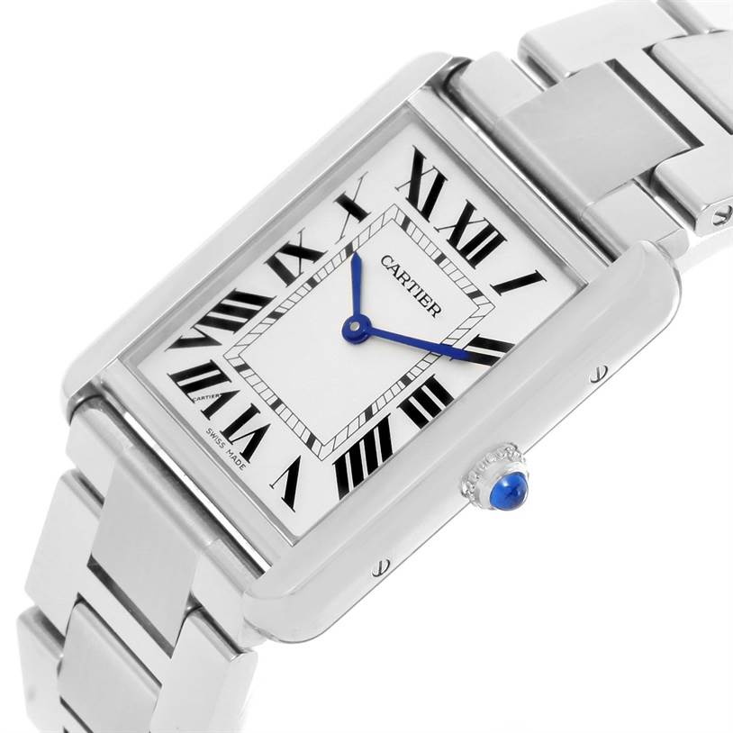 The image shows a tilted top-side view of the Cartier Tank Solo W5200014 Men
s Stainless Steel Silver Dial W5200014 Men
s Stainless Steel Silver Dial watch, highlighting the rectangular face, Roman numerals, blue hands, and a metal bracelet.