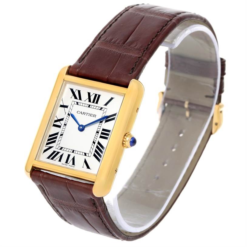 The Cartier Tank Solo W1018855 Men
s Steel and Gold (two tone) Silver Dial W1018855 Men
s Steel and Gold (two tone) Silver Dial watch is shown at a slight angle, displaying its dial, strap, and crown with blue cabochon.