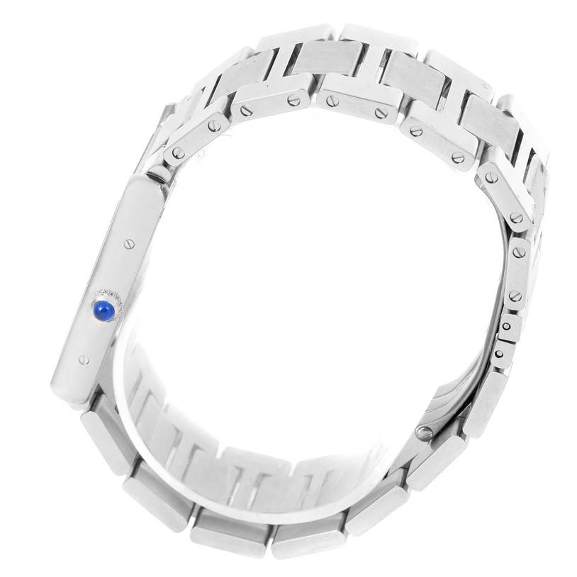 This image shows a side view of the Cartier Tank Solo W5200014 Men
s Stainless Steel Silver Dial W5200014 Men
s Stainless Steel Silver Dial watch, highlighting its metal bracelet and crown with a blue cabochon.