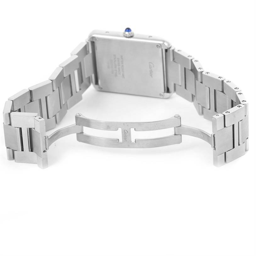 The image shows the back and bracelet clasp of the Tank Solo watch by Cartier, with the bracelet partially opened.