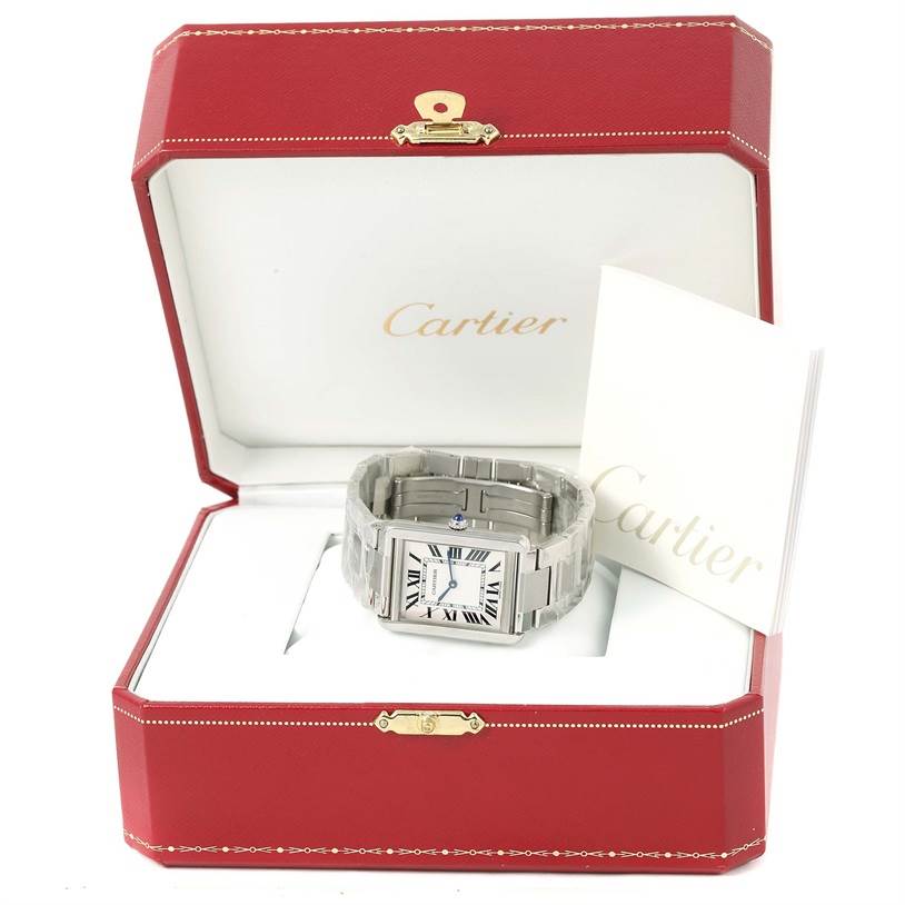 The Cartier Tank Solo W5200014 Stainless Steel Silver Dial W5200014 Stainless Steel Silver Dial watch is angled frontally, displayed in its red box with a booklet.