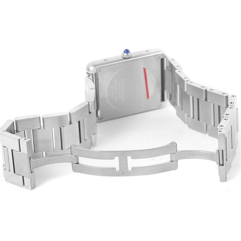 The image shows the back and opened clasp of a Cartier Tank Solo W5200014 Stainless Steel Silver Dial W5200014 Stainless Steel Silver Dial watch, highlighting the stainless steel bracelet and deployment clasp.