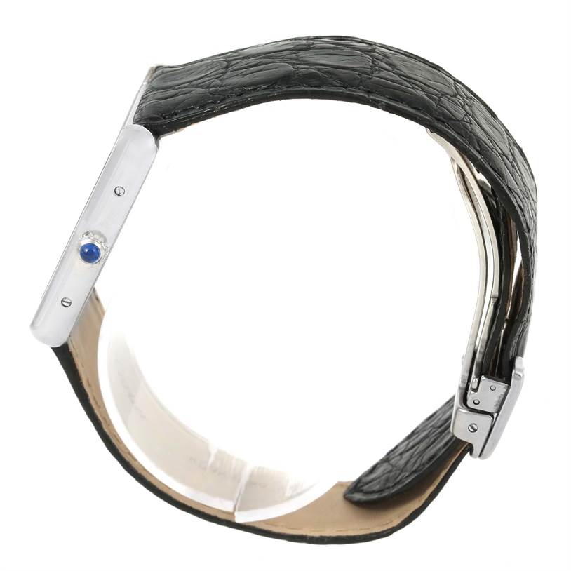 The Cartier Tank Solo W1018355 Men
s Stainless Steel Silver Dial W1018355 Men
s Stainless Steel Silver Dial watch is shown from the side, highlighting the case, crown, and leather strap with buckle.