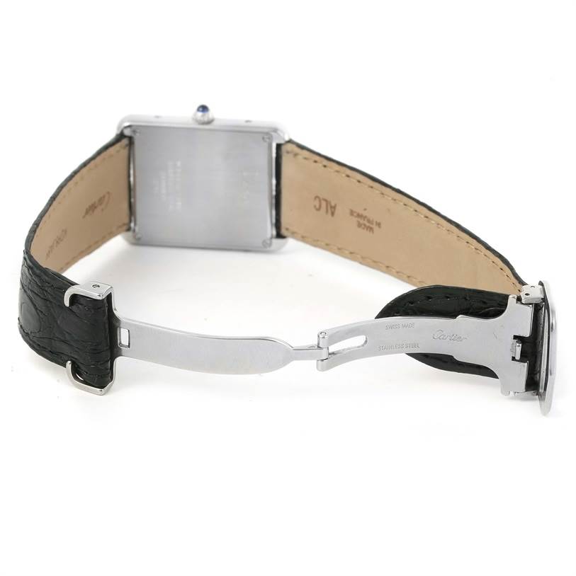 The image shows the back of a Cartier Tank Solo W1018355 Men
s Stainless Steel Silver Dial W1018355 Men
s Stainless Steel Silver Dial watch, highlighting the leather strap and stainless steel clasp.