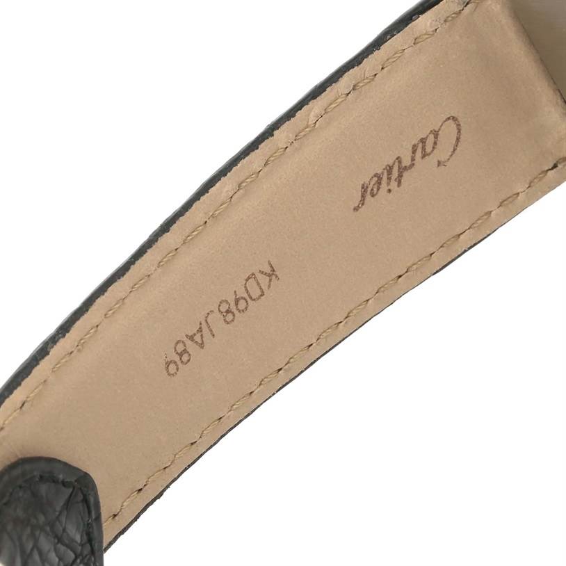 The image shows the inner side of the leather strap of a Cartier Tank Solo W1018355 Men
s Stainless Steel Silver Dial W1018355 Men
s Stainless Steel Silver Dial watch, featuring the brand name and serial number.