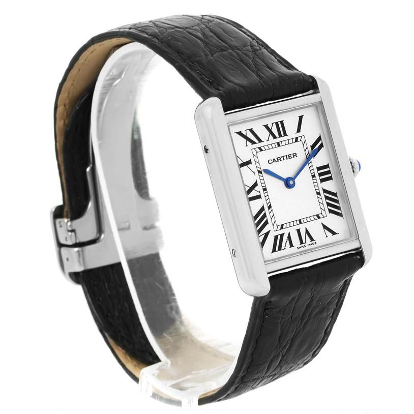 The Cartier Tank Solo W1018355 Men
s Stainless Steel Silver Dial W1018355 Men
s Stainless Steel Silver Dial watch is shown at a three-quarter angle, displaying its rectangular face, Roman numerals, and black leather strap.
