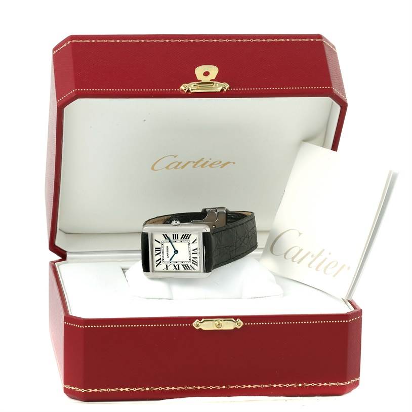 The Cartier Tank Solo W1018355 Men
s Stainless Steel Silver Dial W1018355 Men
s Stainless Steel Silver Dial watch is shown in a cushioned red box, with the face, strap, and a booklet visible.