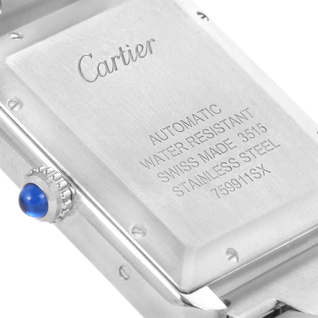 The image shows the back casing and crown (with blue cabochon) of a Cartier Tank Solo W5200028 Men
s Stainless Steel Silver Dial W5200028 Men
s Stainless Steel Silver Dial watch.