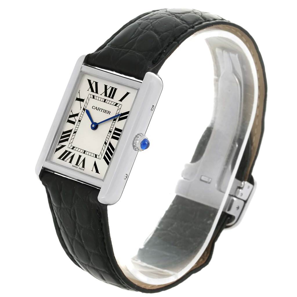 The image shows a Cartier Tank Solo W1018355 Men
s Stainless Steel Silver Dial W1018355 Men
s Stainless Steel Silver Dial watch at a slight angle, highlighting its rectangular face, Roman numerals, blue hands, and leather strap.
