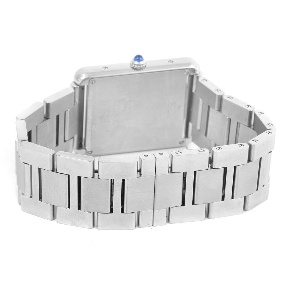 The image shows the back view of a Cartier Tank Solo W5200014 Men
s Stainless Steel Silver Dial W5200014 Men
s Stainless Steel Silver Dial watch focusing on its rectangular case and metallic bracelet.