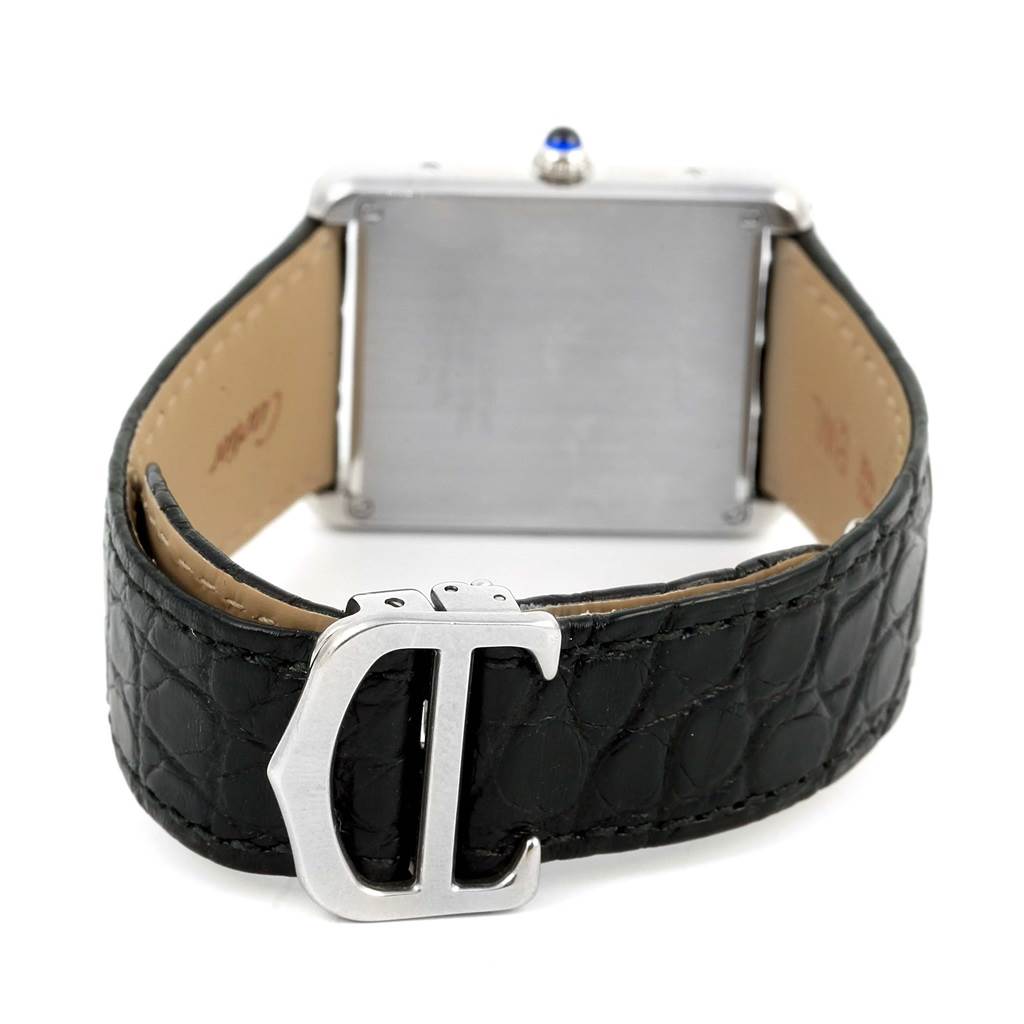 The Cartier Tank Solo W1018355 Stainless Steel Silver Dial W1018355 Stainless Steel Silver Dial watch is shown from the back, highlighting its black strap and clasp.