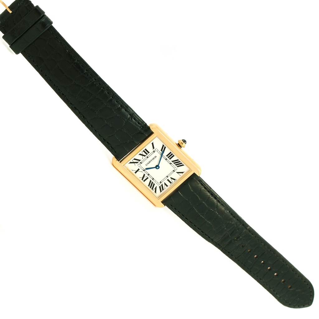 This image shows the Tank Solo model by Cartier from a top view, fully displaying its face and black leather strap.